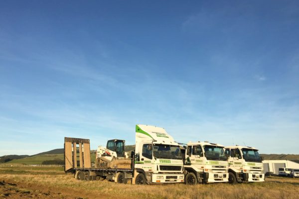 Three Thornz Landscapes Trucks On Site With Bobcat And Excavator On Back