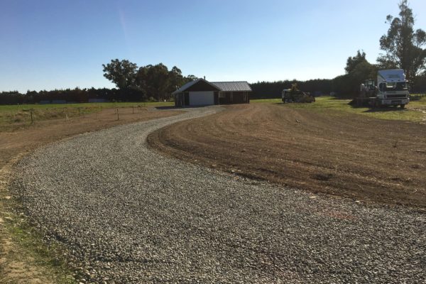 Thornz Landscapes On Site After Gravel Driveway Installation and Land Preparation for Lawn Seed And Fertilisation