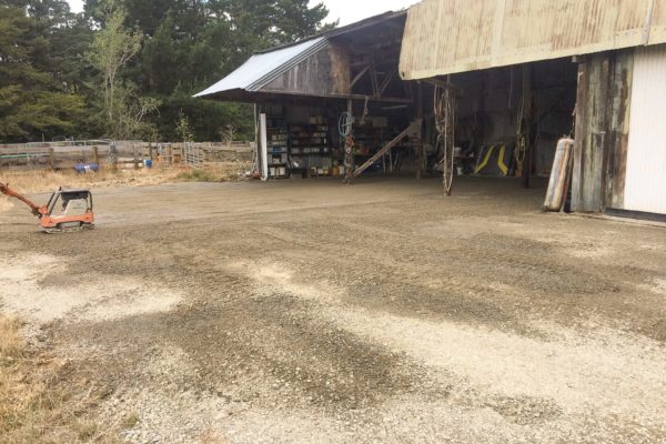 Plate Compactor Compacting Material In Preparation For Driveway and Surfacing For Rural Shed