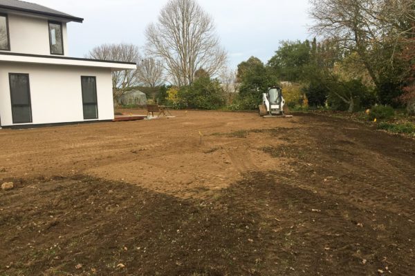 Bobcat Preparing Ground For Lawn Sowing And Fertilisation Of Large Lawn Area