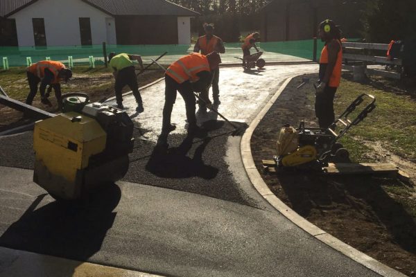 Thornz Landscapes Team On Site Smoothing Asphalt For Residential Driveway