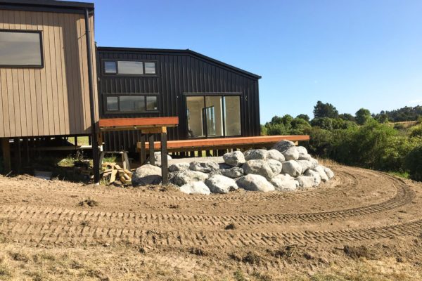 Preparation Underway For Concrete Driveway Installation. Large Rocks Unloaded Landscape Architecture For Patio