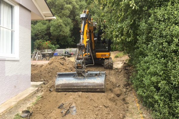 Thornz Landscapes JCB Excavator On SitePreparing Ground For Lawn Reseeding And Landscaping