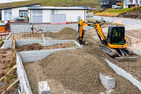 Thornz Landscapes On Site Filling Retaining Wall With Material To Prepare For Foundation On A Hill House Build