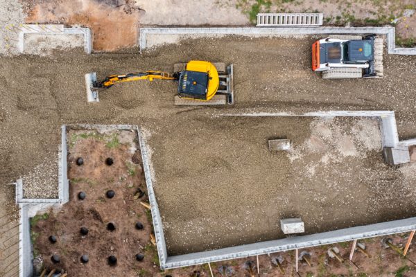 Drone Photo Of Thornz Landscapes Compact Exvacator & Skid Steer On Site Preparing Land For Concrete Foundation