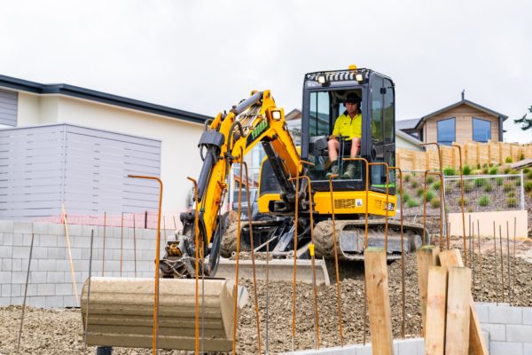 JCB Compact Excavator Completing Earthworks Preparation For Concrete Foundation For House Build